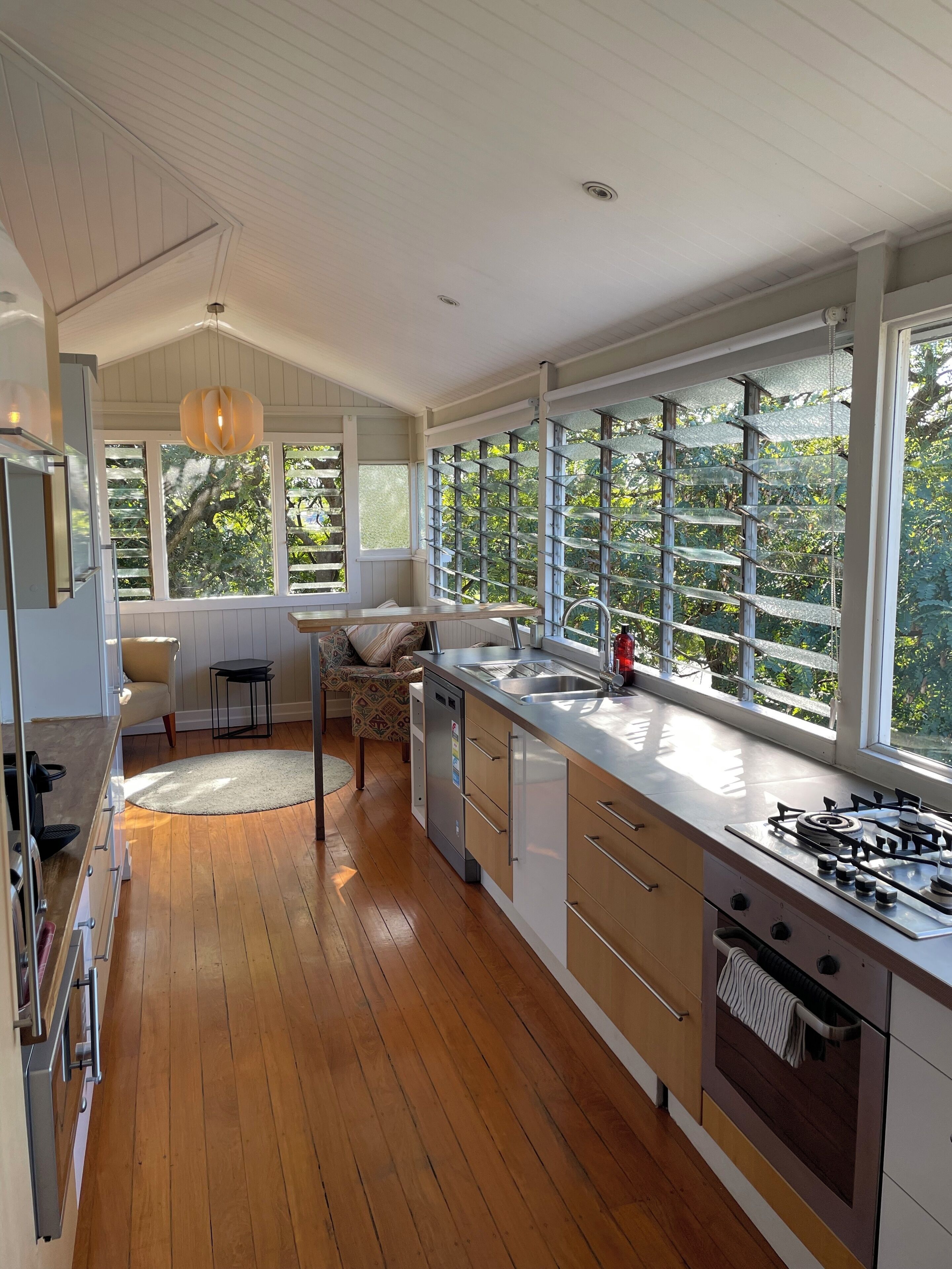 Kitchen looking into the treetops and with city views