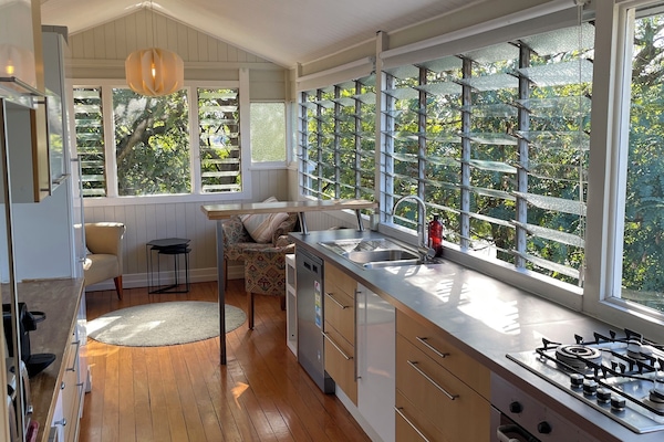 Kitchen looking into the treetops and with city views