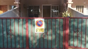 A gated entrance with a sign indicating permanent vehicle prohibition.