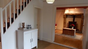 A staircase with white railings, a white cabinet with drawers, and a wooden floor. - Idyllic Rural Retreat. Pool & Games Room. IDEAL COUPLES, FAMILY OR INDEPENDENTS (Lanrivain)