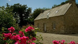 A stone house with a gravel driveway and a garden of pink flowers. - Idyllic Rural Retreat. Pool & Games Room. IDEAL COUPLES, FAMILY OR INDEPENDENTS (Lanrivain)