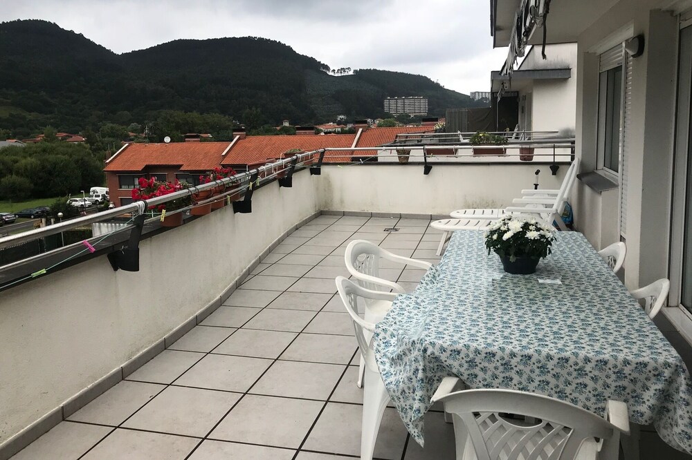 a cozy and charming pennhouse with a wonderful view