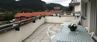 a cozy and charming pennhouse with a wonderful view