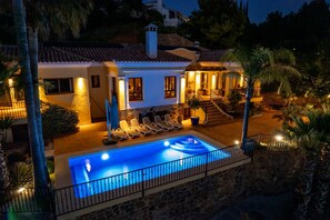 A poolside view of a house with a swimming pool, lounge chairs, and a staircase leading to the upper level. - Ultra-Luxury Family Home: Breathtaking Views, Retro Cinema & Americana diner. (Mijas)