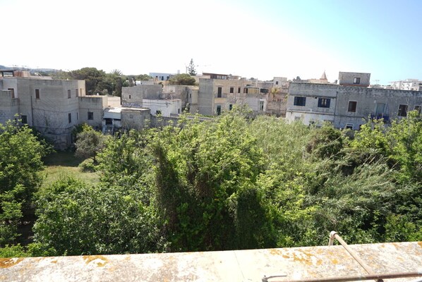 A view of a residential area with multiple buildings, some with visible balconies and windows.