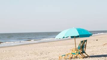 On the beach, sun loungers, beach towels
