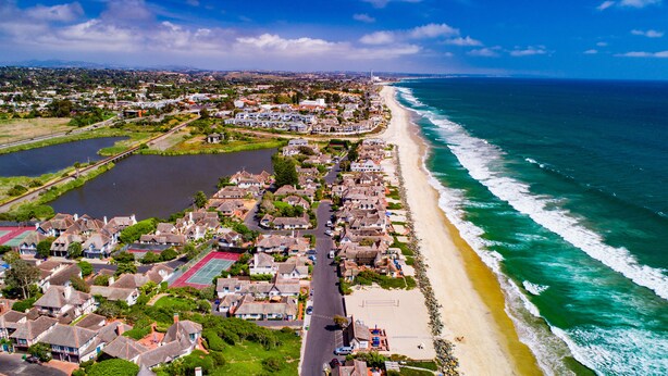 A coastal residential area with houses, a beach, and a water body. - 4-bedroom vacation home just 12 minutes from LEGOLAND® California (Oceanside)
