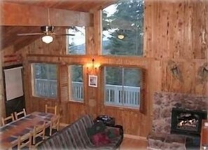 Living/dining areas, with panoramic lake and mountain views through the windows