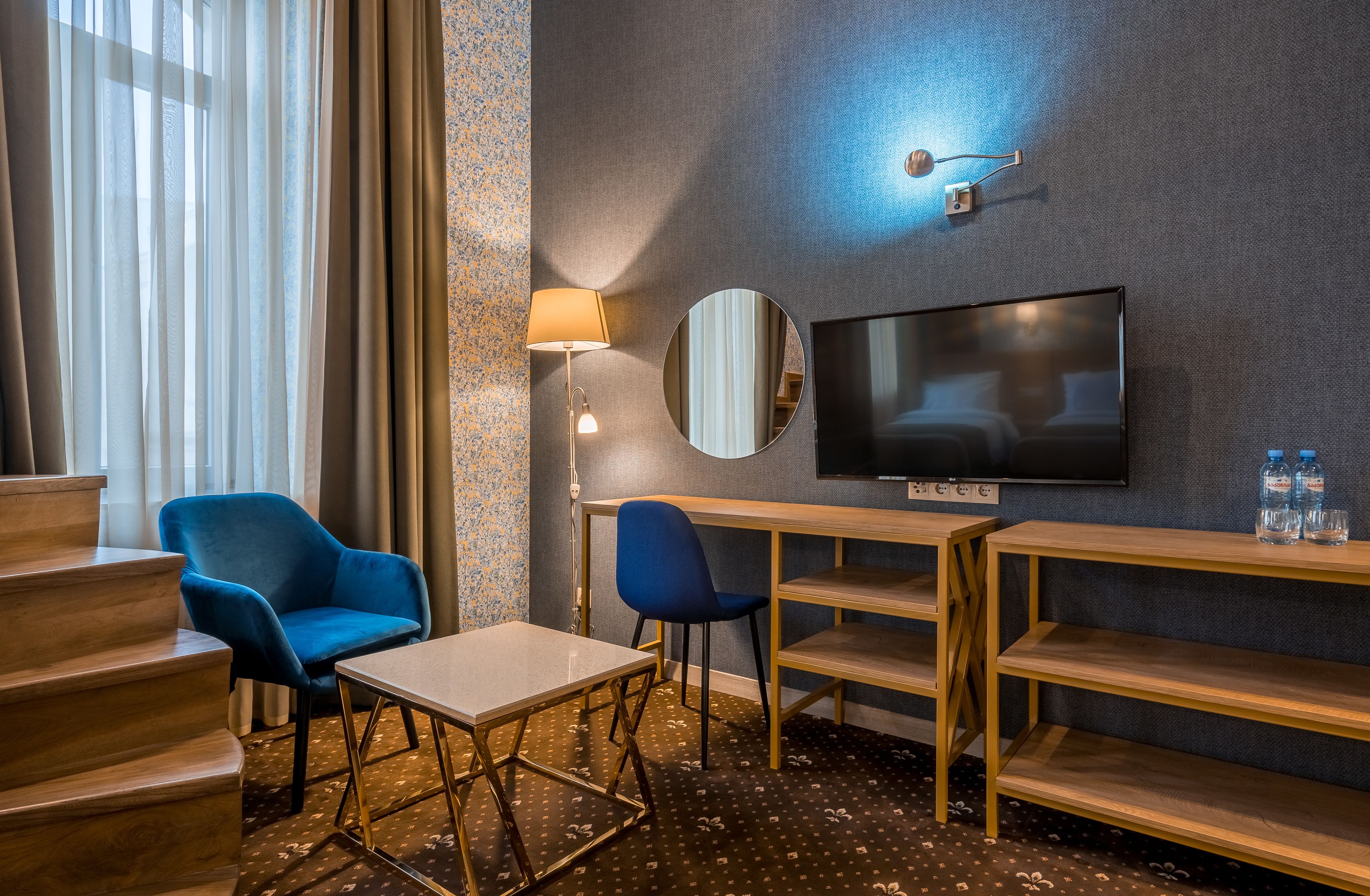 Deluxe Family Duplex Room | Minibar, in-room safe, individually decorated, desk