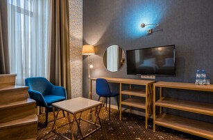 Deluxe Family Duplex Room | Minibar, in-room safe, individually decorated, desk