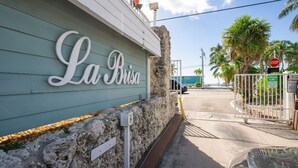 A building with a sign reading "La Brisa" and a gated entrance.