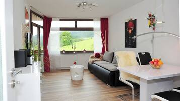 Flat-screen TV, foosball, table tennis, books