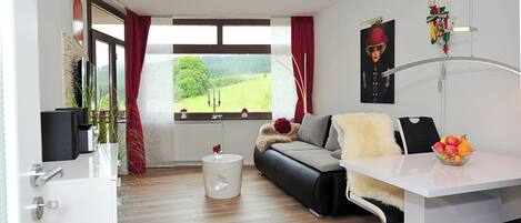 Flat-screen TV, table football, ping pong, books