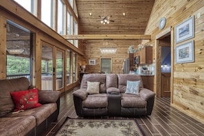 Relax in comfort with a plush sectional sofa and enjoy the view from the large window.