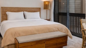 A bedroom with a large bed, a bedside table, a lamp, and a view of the outside balcony. - Scandinavian 72 Vantage Condo with Private Hot Tub by RedAwning (Park City)