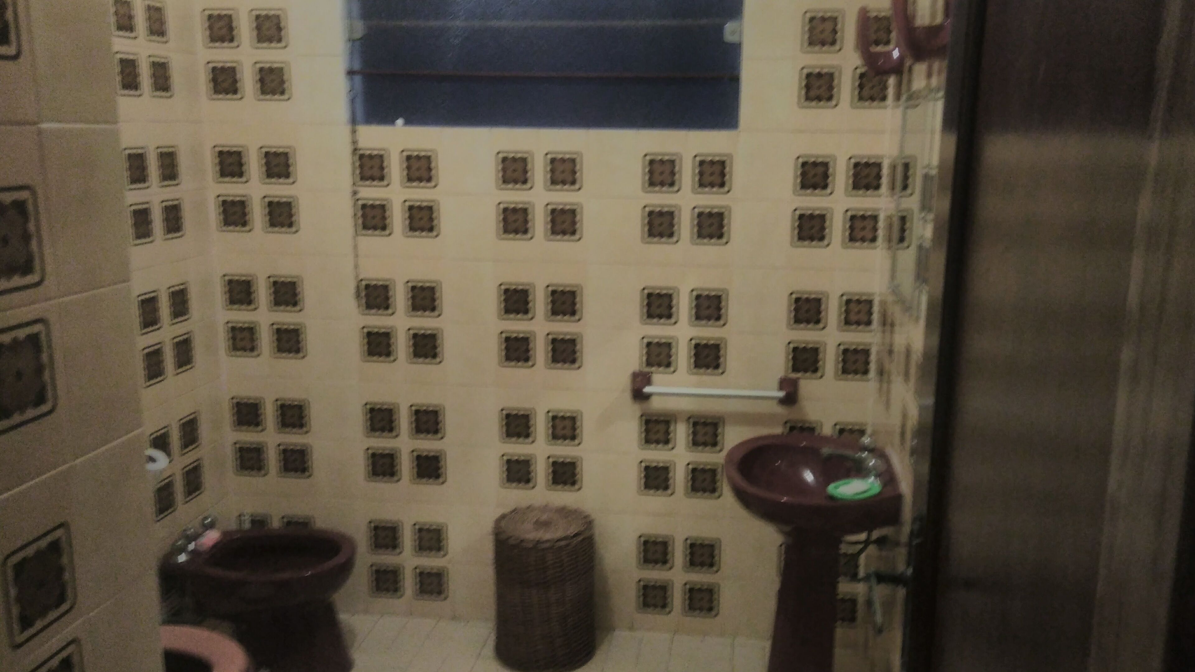A small bathroom with a toilet, bidet, and sink.