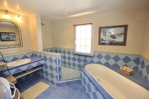 Combined shower/tub, hair dryer, towels, toilet paper