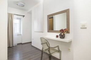 A modern bathroom with a glass chair, a mirror, and a vase with flowers on a shelf. - Ideal for a family vacation. Heated pool. Local breakfast optional available (Svetvincenat)