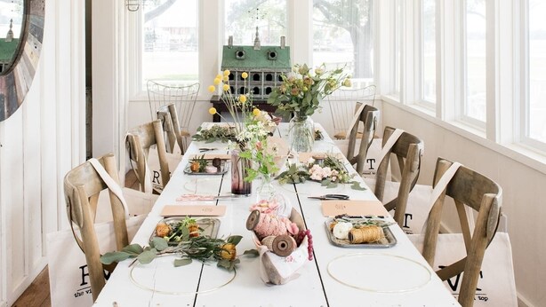 A dining room with a long table, white walls, wooden beams, and large windows. - ★ Seen in 250 Articles ★ 1min → Town ★ Private ★ Great Kitchen ★ Luxury Home ★ (Round Top)