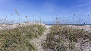 On the beach, sun loungers, beach towels