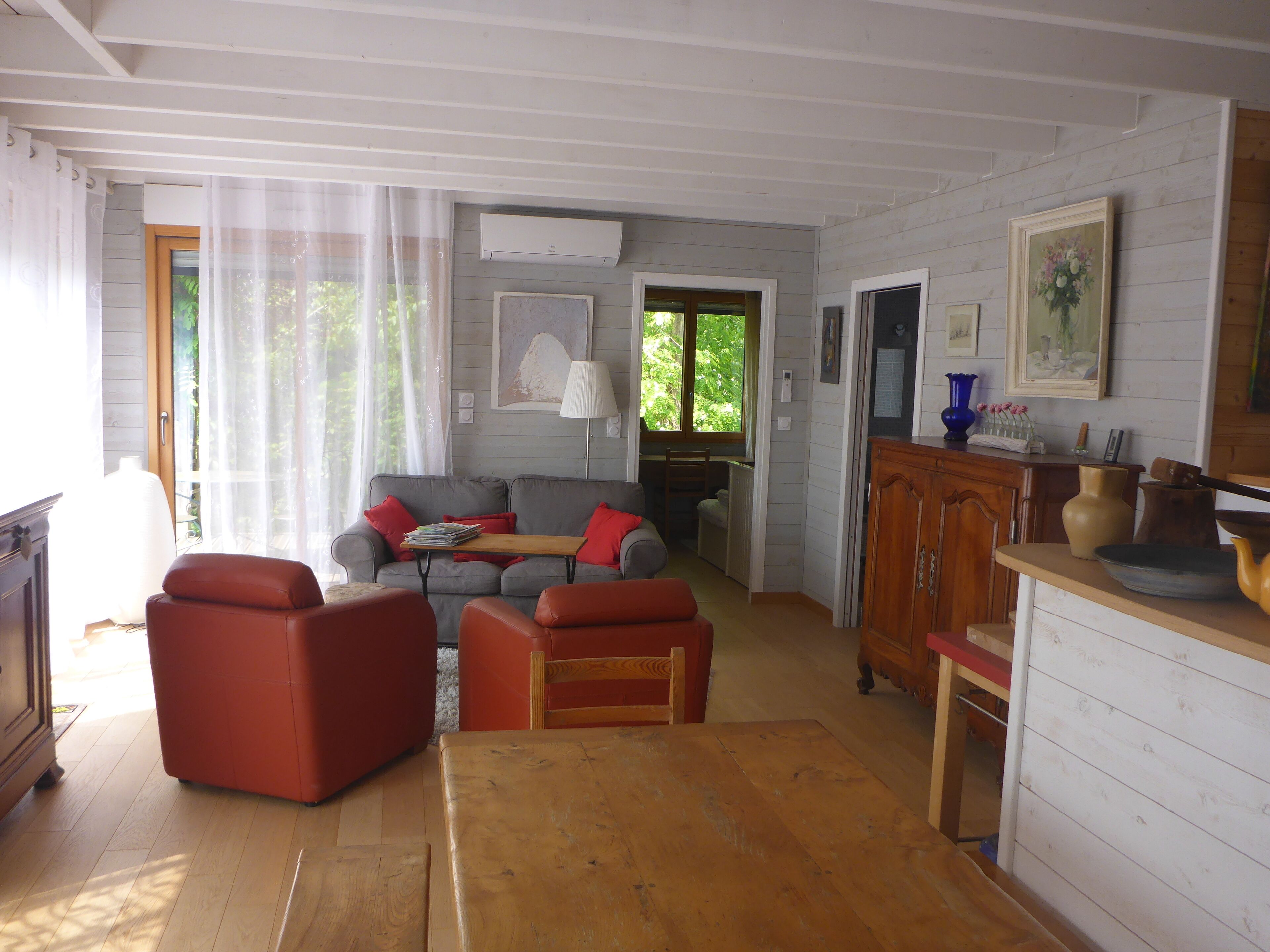 Comfortable wooden house near village and sea on the edge of the forest