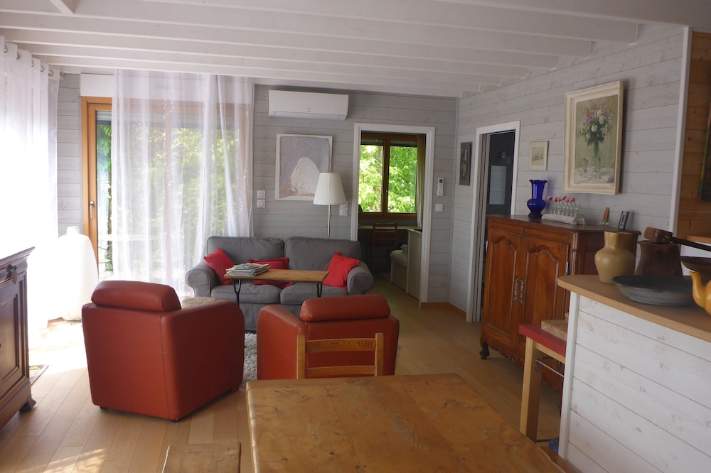 Comfortable wooden house near village and sea on the edge of the forest