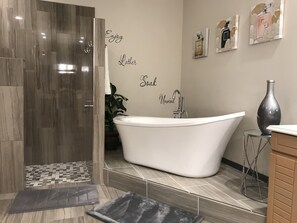 Bathtub, hair dryer, towels, soap