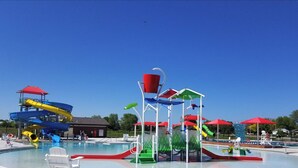 A water park with multiple slides and a pool area. - The Retreat on Lake Michigan Spectacular 6 bd/4bth 4000 sqft (Kenosha)