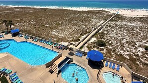 A resort with a large pool, a beach, and a boardwalk. - Phoenix VI #606 - Resort Style complex owner's Beach Chairs Included in Rental (Orange Beach)