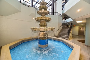 Enjoy the soothing sound of water cascading down a multi-tiered fountain in our indoor pool area.