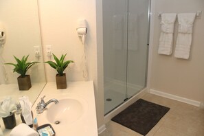 Combined shower/tub, hair dryer, towels, soap