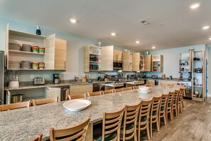Enjoy cooking in this open kitchen with ample counter space and a large island for socializing.