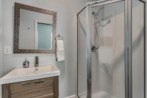 Combined shower/bathtub, towels, toilet paper