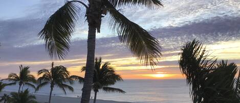 On the beach, sun-loungers, beach towels