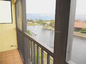 Enjoy a serene view of the lake from this balcony.