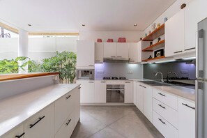 Fridge, microwave, stovetop, coffee/tea maker