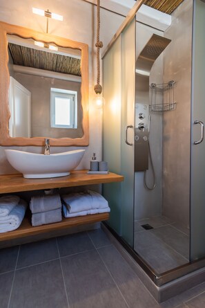 Superior Suite, Jetted Tub, Sea View | Bathroom | Shower, hydromassage showerhead, hair dryer, bathrobes - Milesian Suites (Milos)