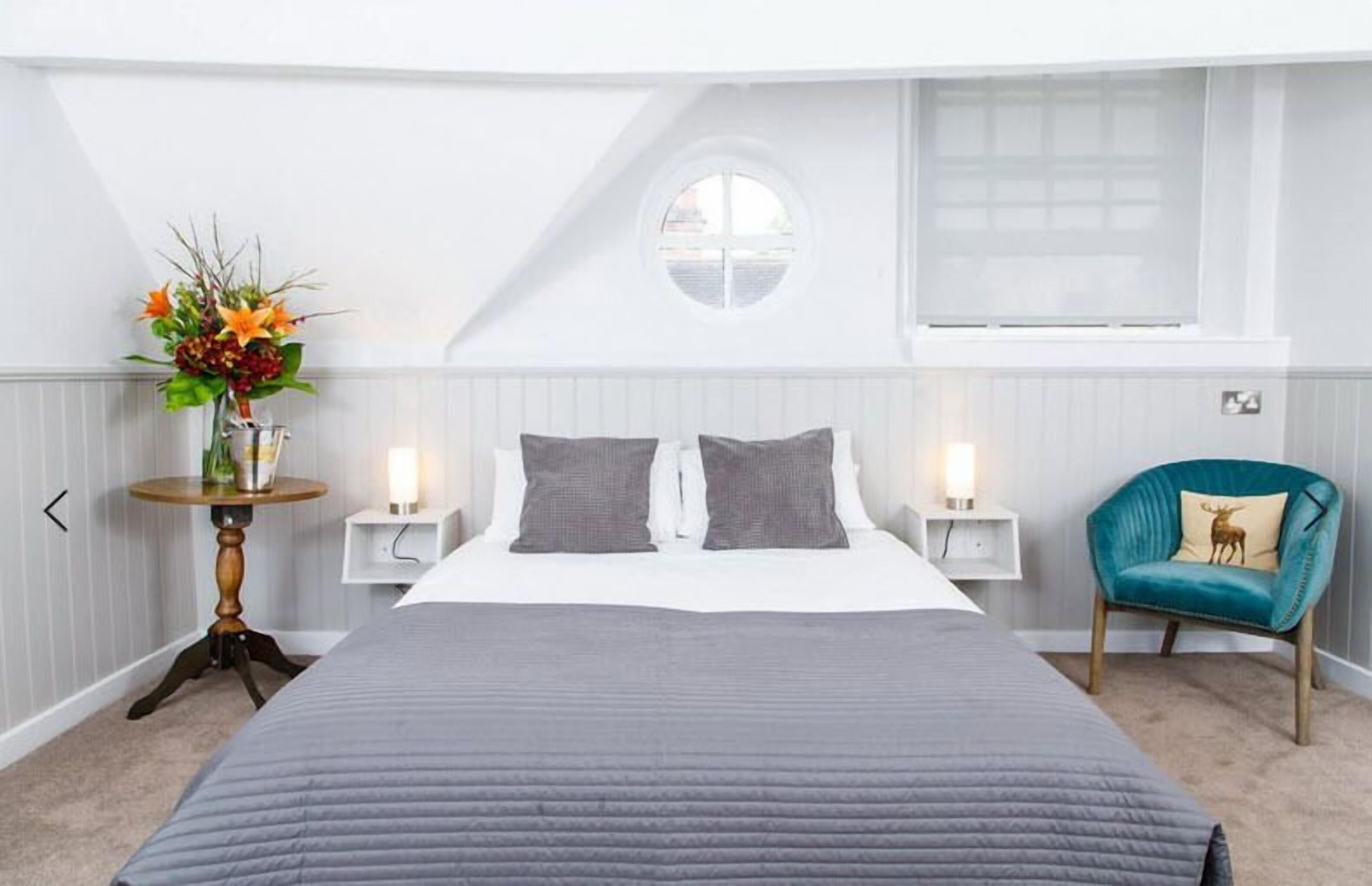 Desk, iron/ironing board, bed sheets