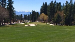 A golf course with a clear view of a mountain range in the background. - Peaceful Creekside Retreat with Pool Access, Family-Friendly (Incline Village)