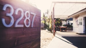 A wooden sign with the number 3287.