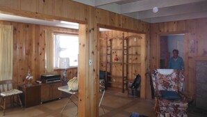 A wooden-paneled room with a desk, chair, and shelves. - Mountain Rustic Ski House Tahoe-Reno  Mt Rose-Snow Resort 1.5 Miles (Reno)