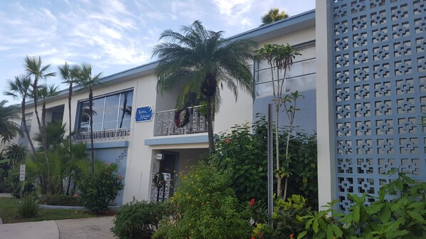 A two-story building with a sign reading "Naples Marina". - CONDO BY THE BEACH #2 (Naples)