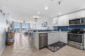 Fridge, microwave, oven, stovetop - Waves, Views & Vacay – 2BR Beachfront w/ Direct Beach Access (Pensacola Beach)