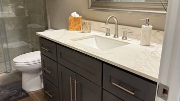 Combined shower/tub, hair dryer, towels, soap