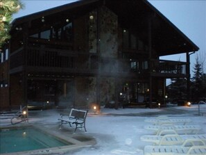 A large lodge with a pool area, benches, and lounge chairs. - Remodeled 1 Bedroom Condo Short walk to Cabriolet Mountain views from unit (Park City)