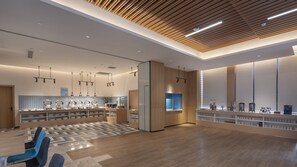 A modern kitchen with a central island, pendant lighting, and a patterned floor. - Holiday Inn Express Nanjing Dongshan by IHG (Nanjing)