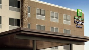 A Holiday Inn Express & Suites building with a modern design, featuring a flat roof, large windows, and a prominent entrance with a covered walkway. - Holiday Inn Express & Suites La Grange by IHG (La Grange)
