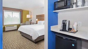 A hotel room with a bed, a desk with a microwave, a coffee maker, and a dishwasher. - Holiday Inn Express & Suites La Grange by IHG (La Grange)