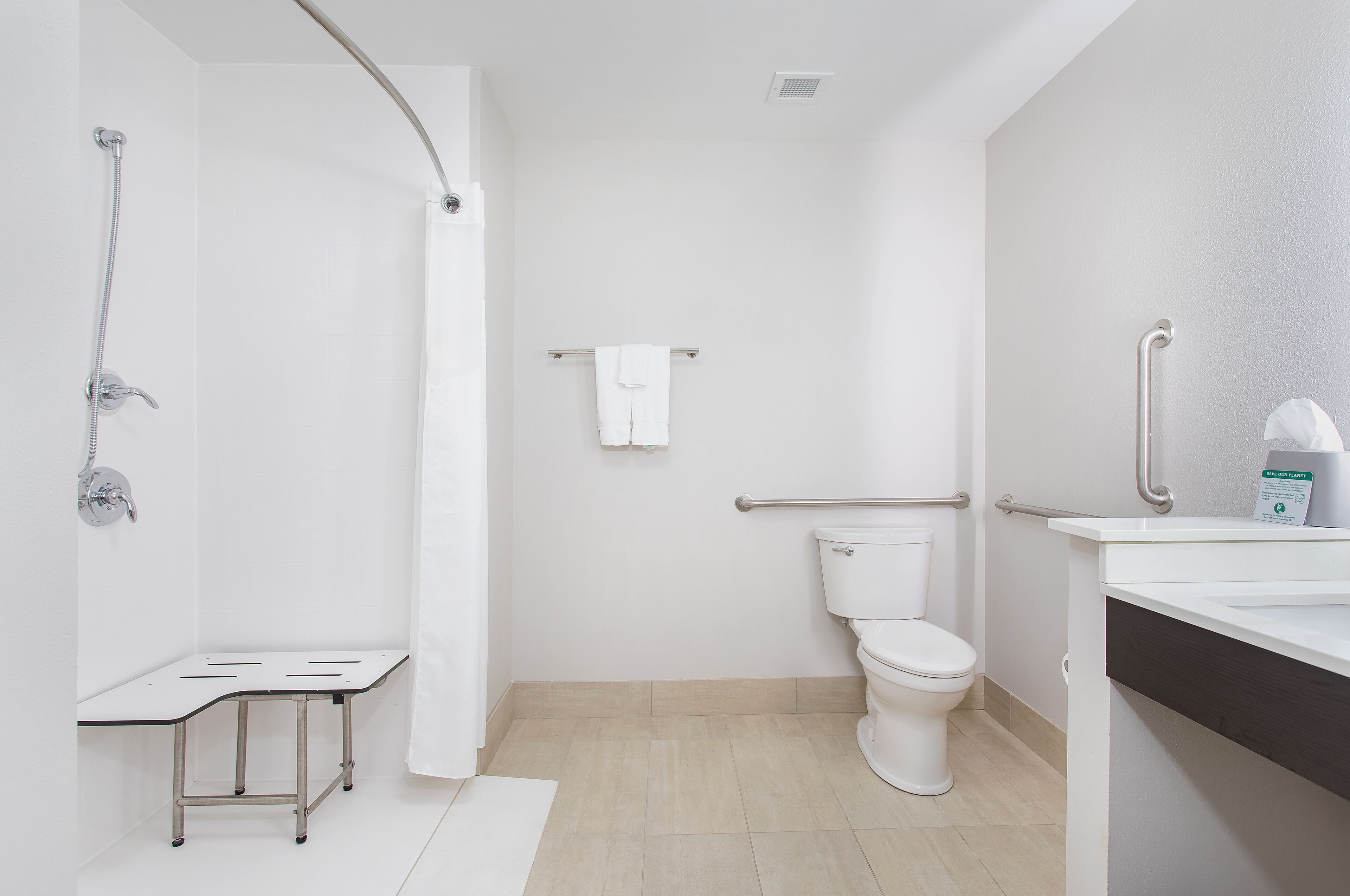 combined shower/bathtub, free toiletries, hair dryer, towels