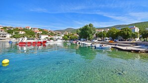 A marina with boats docked, clear water, and buildings in the background. - Wonderful private villa for 10 people with A/C, private pool, WIFI, TV and terrace (Novi Vinodolski)